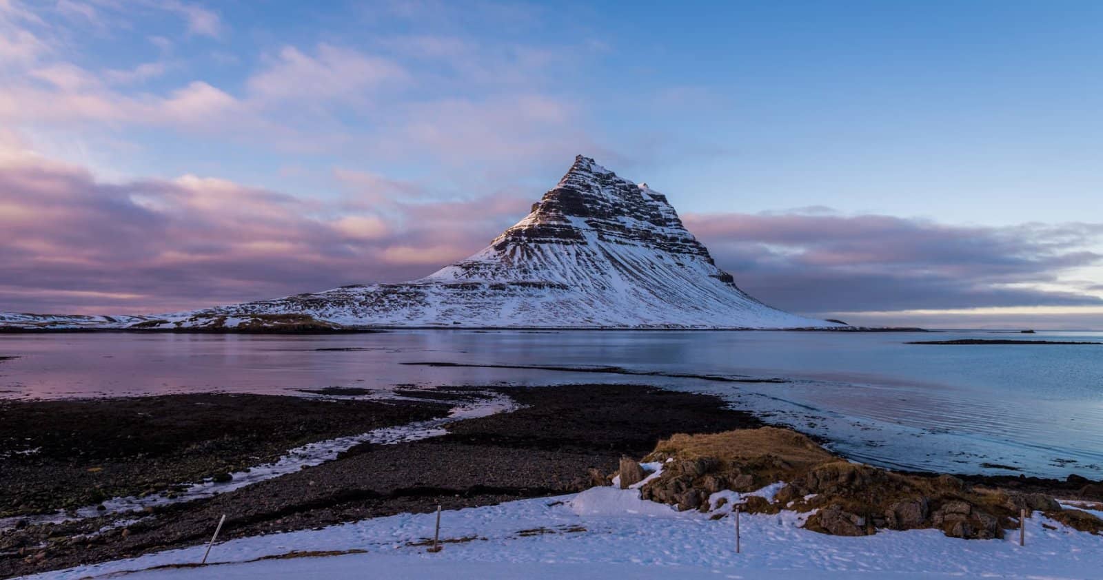 Kirkjufell mountain and frozen lake at dusk, Snæfellsnes peninsula, Iceland