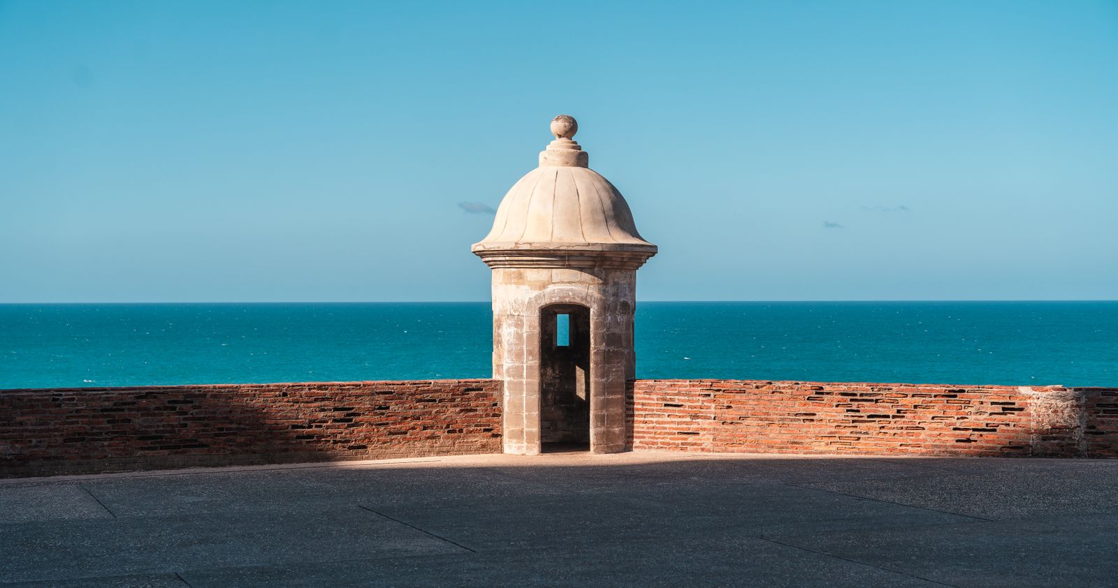 Historic stone sentry box on the fortifications of San Juan, Puerto Rico, overlooking the Atlantic Ocean